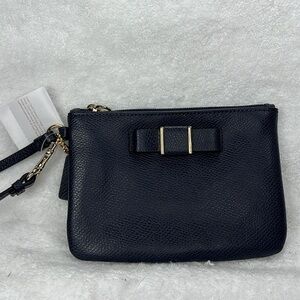 Coach NWT ,midnight, blue bow, wristlet gold hardware, comes with box
